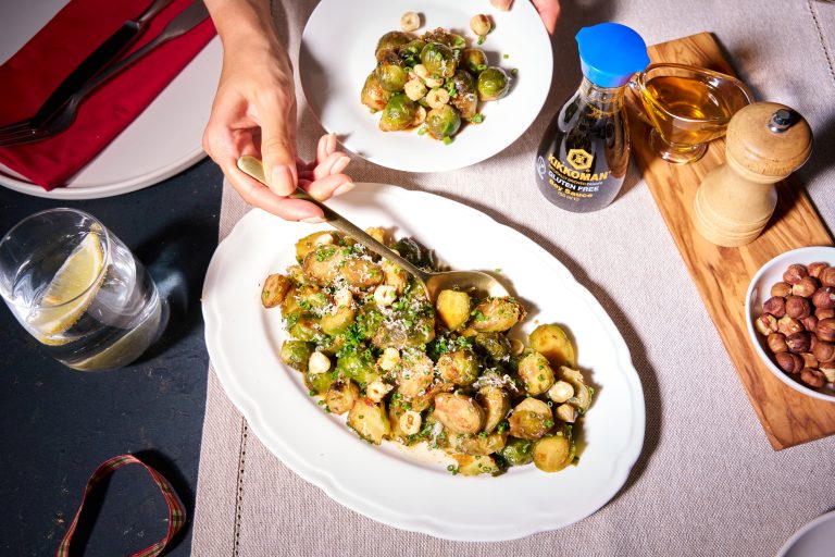 Roasted brussels sprouts with soy-honey glaze and hazelnuts baked brussels sprouts in soy honey glaze topshot dispencer standing